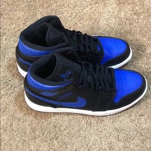 Black and blue Jordan ones